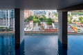 Highrise sky pool in front of small houses in Kuala Lumpur Malaysia