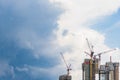 Highrise tower crane and new unfinished residential townhouse un