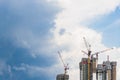 Highrise tower crane and new unfinished residential townhouse un Royalty Free Stock Photo