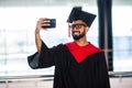 Highschool man graduate after graduation caremony at Uni