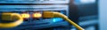 Highspeed server connection, yellow ethernet cable plugged into server for network connectivity Royalty Free Stock Photo