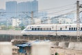 Highspeed train across the city with buildings