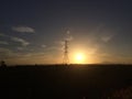 Hight volte electric tower with sunrise.