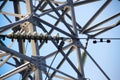 Highvoltage insulator and a fragment of electricity pylon metal Royalty Free Stock Photo
