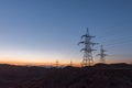 Highvoltage lines pylons in the field Royalty Free Stock Photo