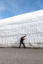 Highway along the snow wall. Norway in spring Royalty Free Stock Photo