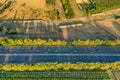 Highway from a bird\'s eye view. As the sun goes down, the sun\'s rays create beautiful long shadows on the ground.