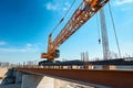 Highway bridge construction site with crane under clear blue sky Royalty Free Stock Photo