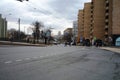 Highway, cars, people, residential buildings in spring Moscow