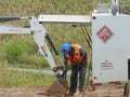 Highway construction equipment maintenance worker