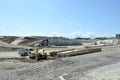 Highway construction site with concrete and steel reinforcement and equipment. Royalty Free Stock Photo