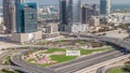 Highway crossroad and office buildings in Dubai Internet City and Media City district aerial timelapse