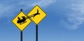 A highway deer crossing warning sign is next to a. similar sign of Santa and his sleigh Royalty Free Stock Photo