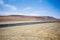 Highway through the desert next to the ocean in National Park Paracas in Ica, Peru Royalty Free Stock Photo