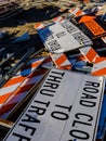Road signs stacked among construction debris Royalty Free Stock Photo