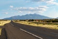 Highway and distant snowcapped mountains in the american southwest Royalty Free Stock Photo