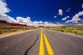 Highway 163, an endless road, Agathla Peak, Arizona, USA Royalty Free Stock Photo