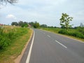 State highway, newly constructed road connecting villages to town.