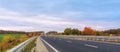 Highway with heavy traffic. Beautiful autumn panoramic view