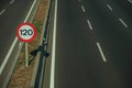 Highway with heavy traffic and SPEED LIMIT signs in Madrid