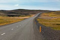 Highway through Icelandic landscape under a blue summer sky Royalty Free Stock Photo