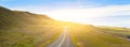 Highway through Icelandic landscape under a blue summer sky. Royalty Free Stock Photo