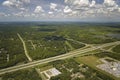 Highway intersection in Florida rural area. Elevated interchange lanes for express passing of car traffic Royalty Free Stock Photo