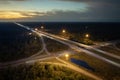 Highway intersection in Florida rural area at sunset. Elevated interchange lanes for express passing of car traffic Royalty Free Stock Photo