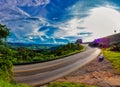 Highway with Landscape of hills with blue sky in the background. Road in mountainous region in Minas Gerais, Brazil