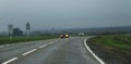 Highway landscape with moving cars at daytime Royalty Free Stock Photo