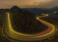 Highway light trails of vehicles during rush hour and sunset Royalty Free Stock Photo