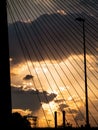 Highway, lightpost, chimney bridge silhouettes at sunset Royalty Free Stock Photo