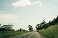 Highway through a lush tropical forest in kauai, hawaii - may 2023 Royalty Free Stock Photo