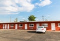 Highway motel against cloudy sky.