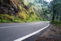 Highway in mountain forest with sunlight Royalty Free Stock Photo