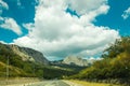 Highway in mountains along sea Crimea in clear sun, cloudy day Royalty Free Stock Photo