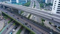 Highway multi-level interchange road with moving cars. Cars are moving on a road junction