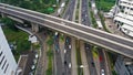 Highway multi-level interchange road with moving cars. Cars are moving on a road junction