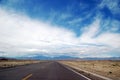 Highway near desert under blue sky