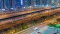 Highway near Dubai marina skyscrapers night timelapse. Royalty Free Stock Photo