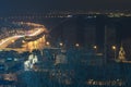 Highway at night along the Dnieper river with tracers and lights, Havana bridge and Naberezhno-Kreschatitska street in Kyiv