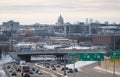 Highway with an overpass, cars driving along the long stretch of road against cloudy sky in St Paul