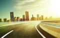 Highway overpass motion blur with city skyline background Royalty Free Stock Photo