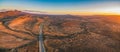 Highway passing through Flinders Ranges at dusk.