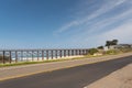 Highway with the Pudding Creek Trestle in the background against the blue sky in Fort Bragg CA Royalty Free Stock Photo