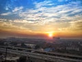 Highway road and cityscape of delhi town india, cloudy dramatic sky