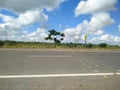 HIghway Road with Clouded Blue Sky Royalty Free Stock Photo