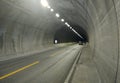 Highway road tunnel. Cars move in a tunnel through a mountain on a freeway. Royalty Free Stock Photo