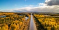 Highway Road by vibrant fall season color trees. Sunny Sky Aerial View. Newfoundland, Canada Royalty Free Stock Photo