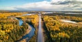 Highway Road by vibrant fall season color trees. Sunny Sky Aerial View. Newfoundland, Canada Royalty Free Stock Photo